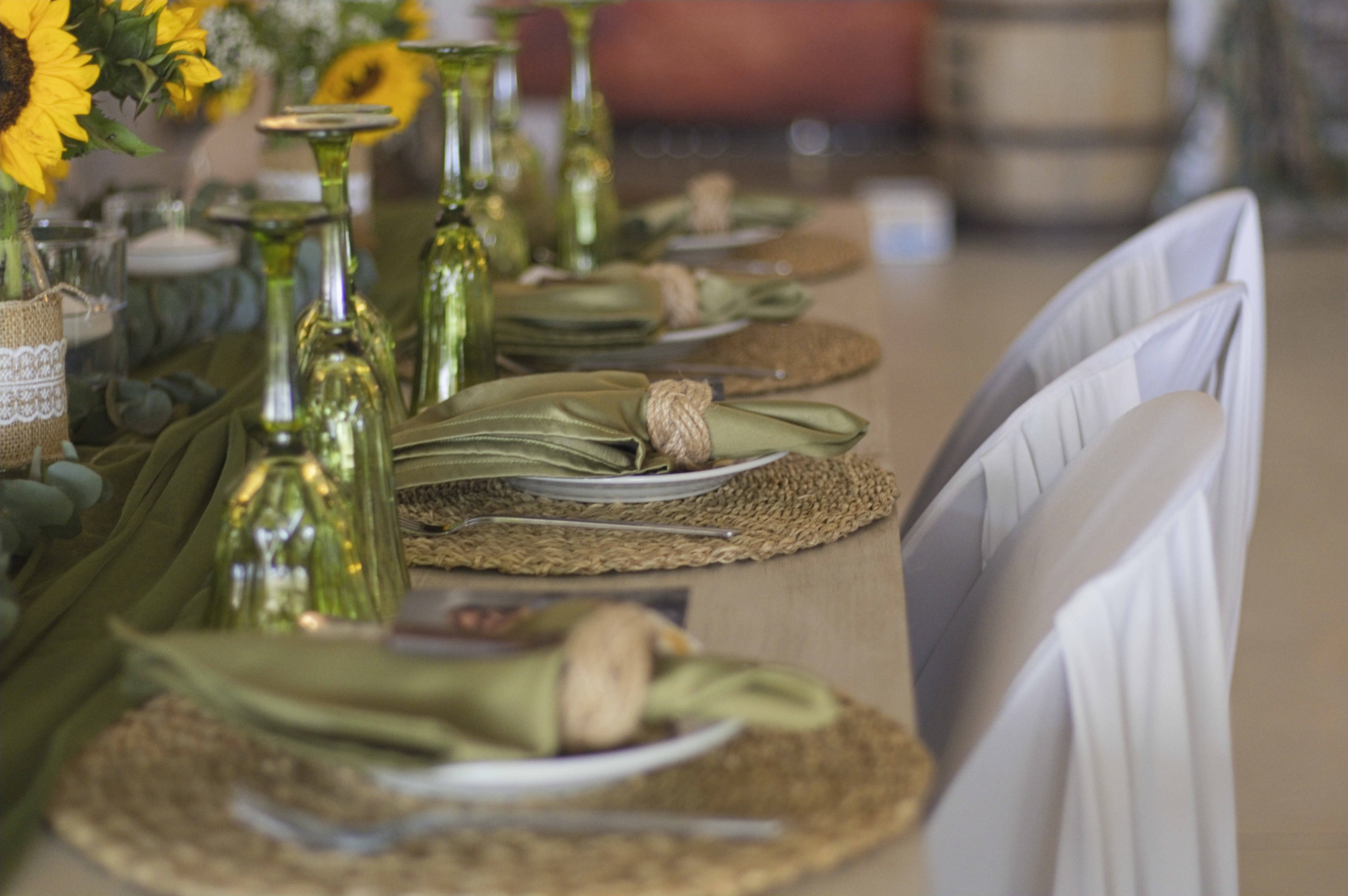 Table detail with green glassware and sage napkins