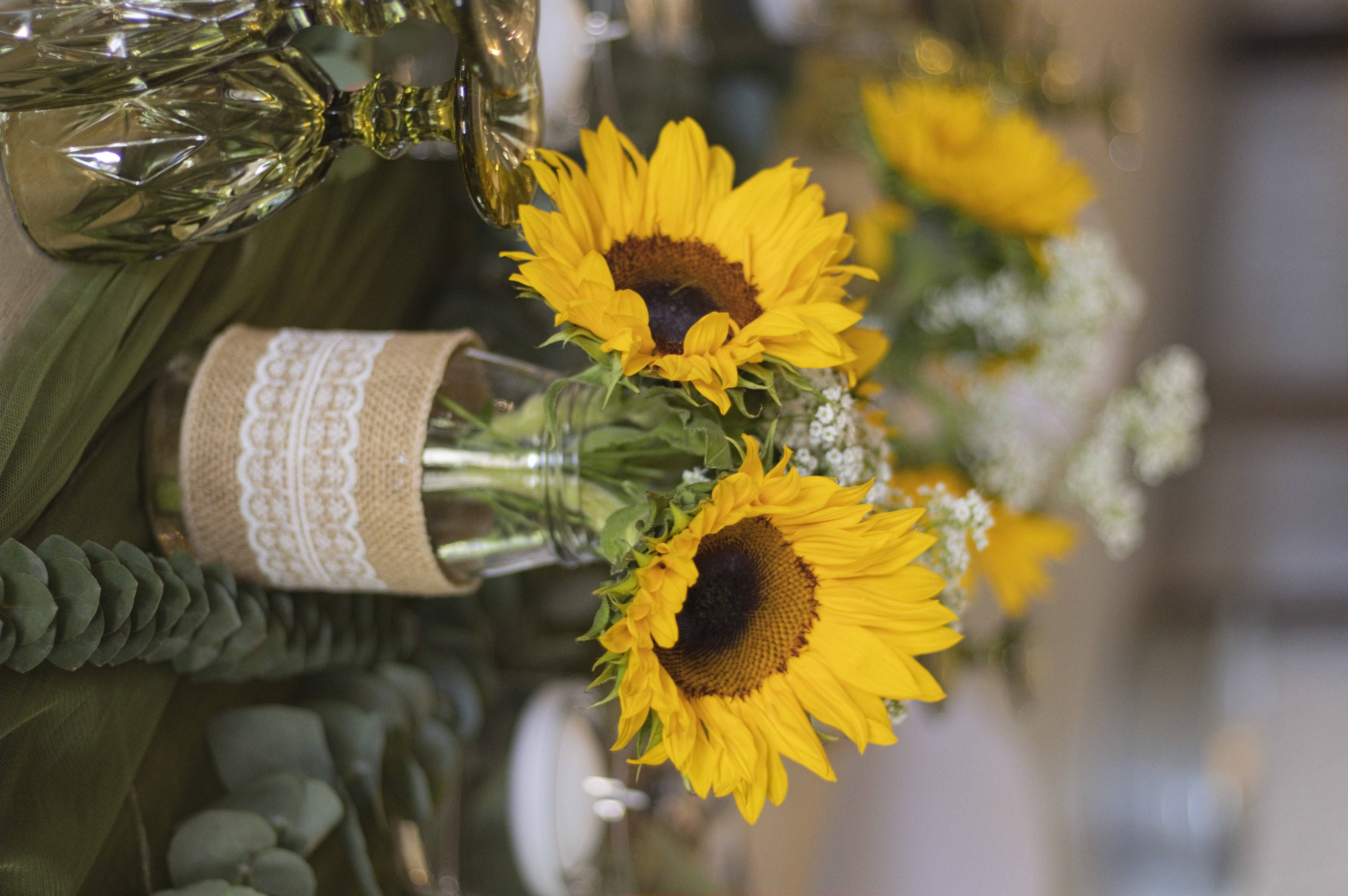 Sunflower centrepiece in a burlap and lace jar